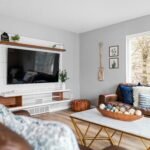 light grey neutral living room wall with furniture accent