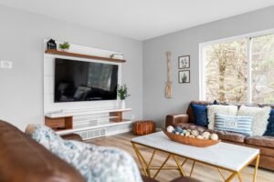 light grey neutral living room wall with furniture accent