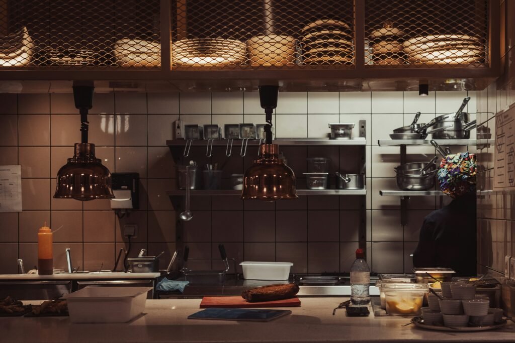 small kitchen with open wall shelving